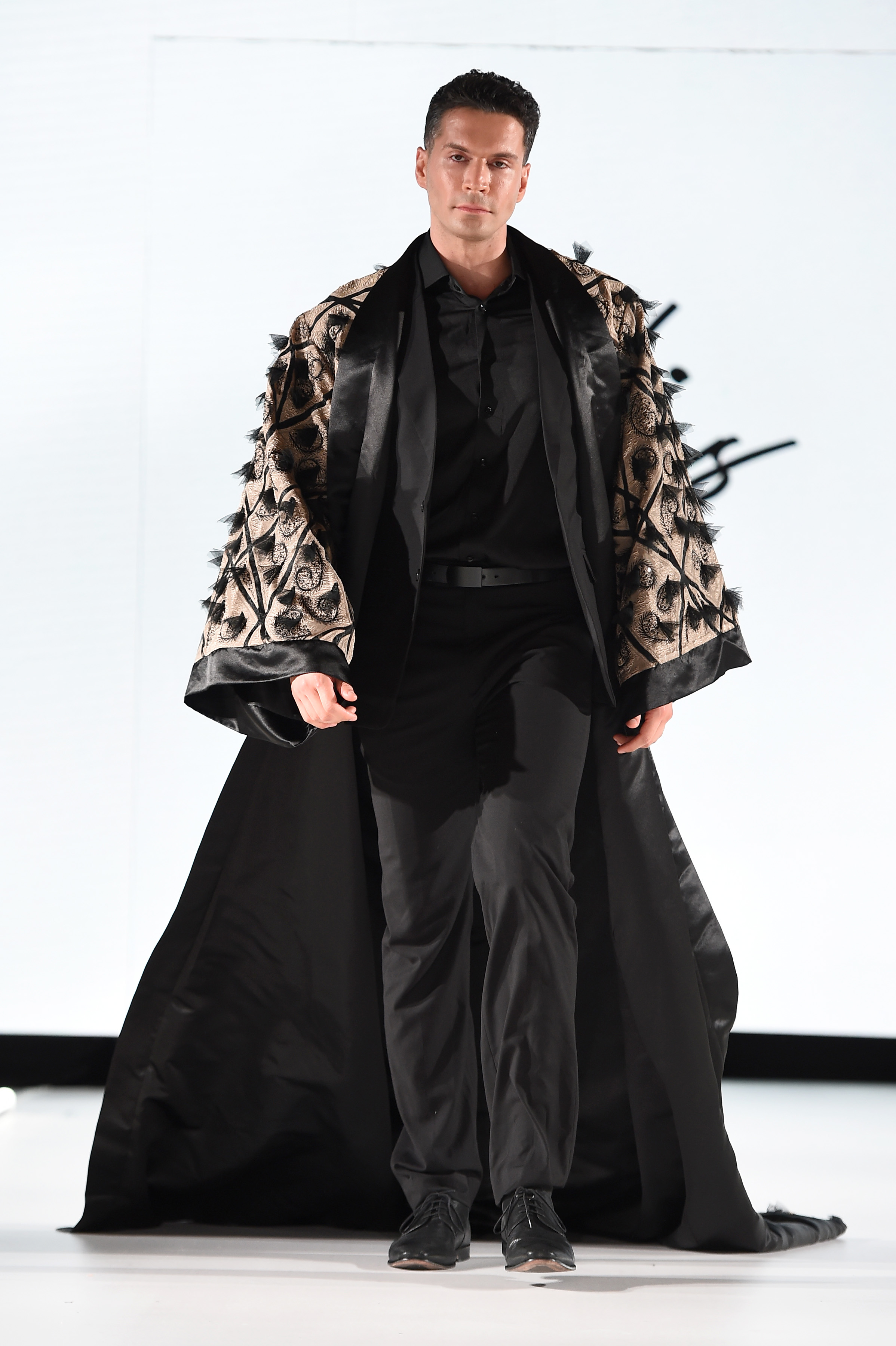 BLACK SUIT WITH EMBROIDERED LUXURY CAPE